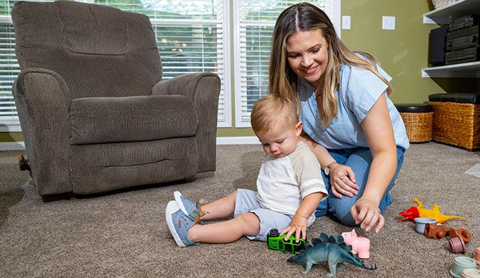 Child playing on clean carpet
