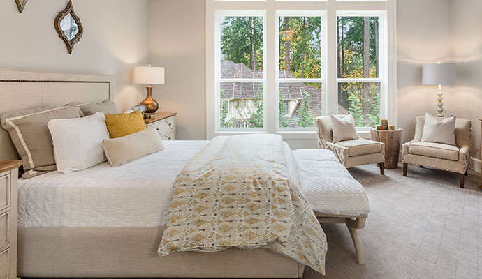 Clean bedding and linens in a master bedroom.