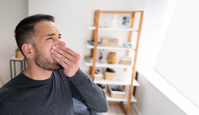 Person experiencing bad odor
