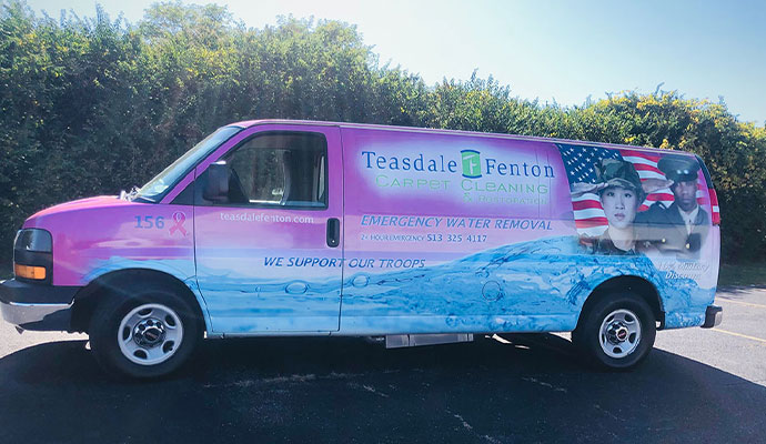 Teasdale Fenton Carpet Cleaning & Restoration service van parked outside.