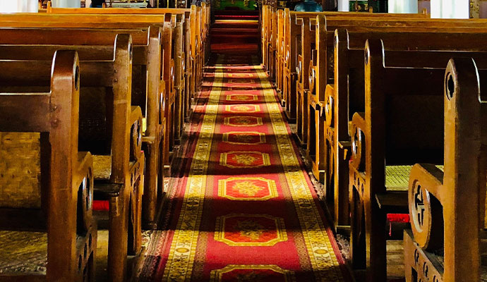 Clean red carpet in a church aisle