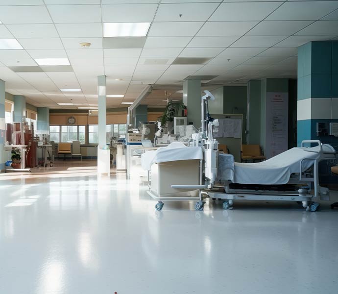 Clean modern hospital room with medical equipment, patient beds and sanitized healthcare environment
