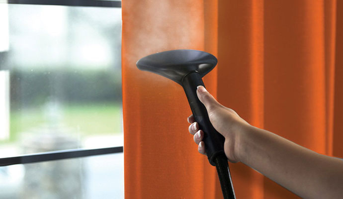 Drapery cleaning using equipment