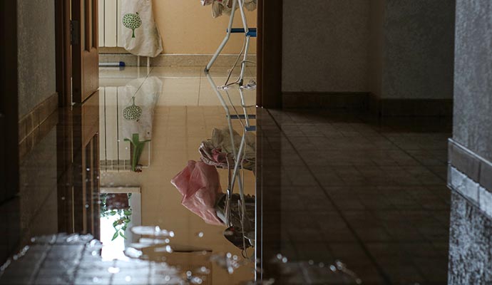 Flooded room floor due to plumbing leak