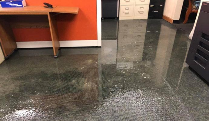 Flooded office with standing water
