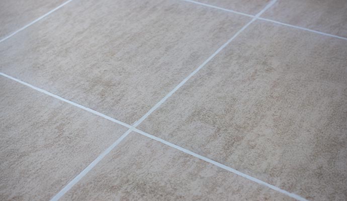 Newly colored grout lines on a tile floor