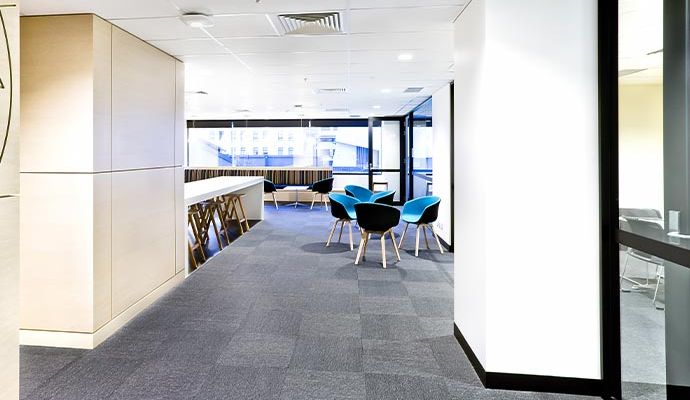 Clean and well-maintained carpet in a modern office space with desks and chairs