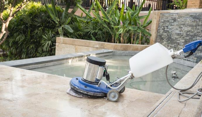 A professional cleaning marble tile with equipment