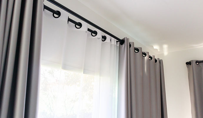 Modern sheer and blackout grommet drapery 
