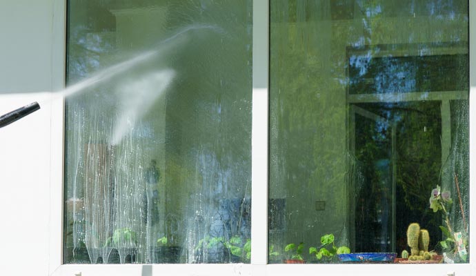 Pressure washing service for window