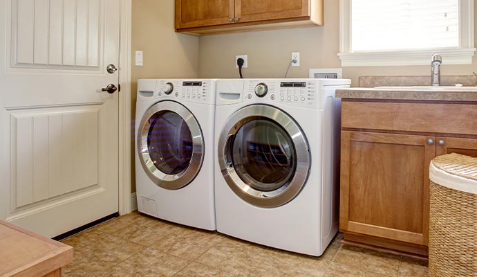 Clean washing machine in a laundry room