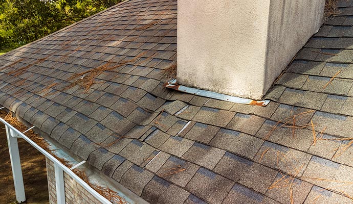 Close up view of a damaged roof with water leak