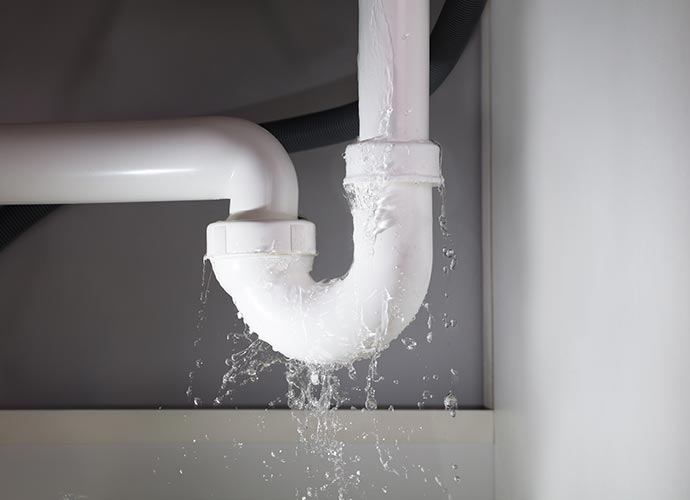 Leaking water pipe under sink 
