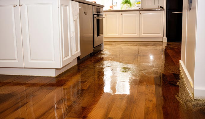 Water damaged wooden floor due to plumbing leak