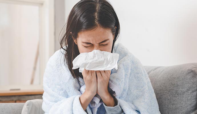 Woman experiencing allergic reaction due to sewage