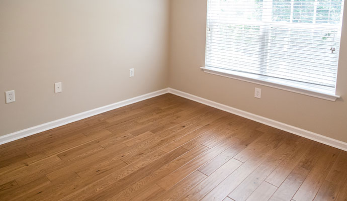Clean hardwood floor in an empty corner