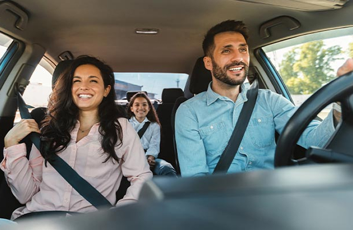 Family enjoying a ride inside a car