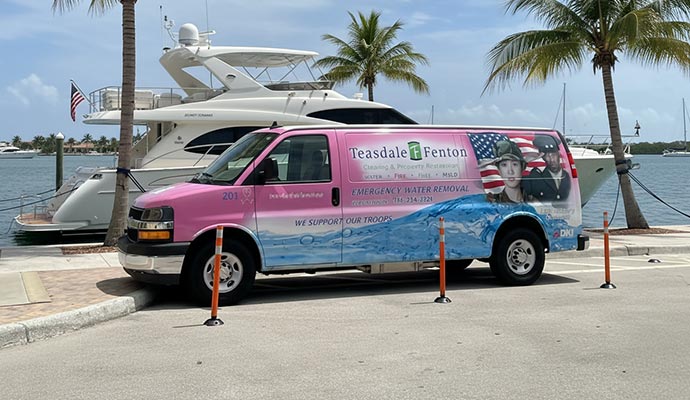 Teasdale Fenton Sarasota service van parked next to a boat