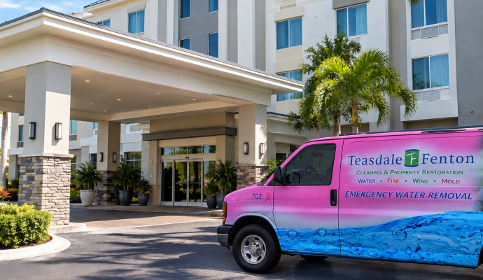 Teasdale Fenton Sarasota service van outside of hotel building