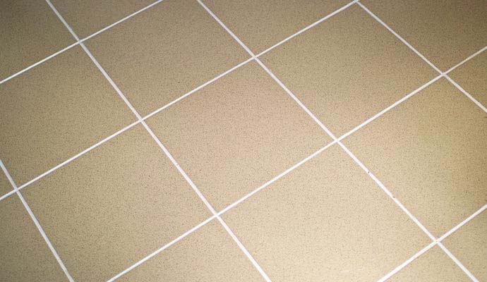 Tile floor grout sealing