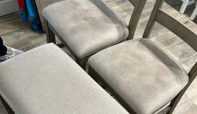 Wooden dining chairs with upholstered fabric seat cushions