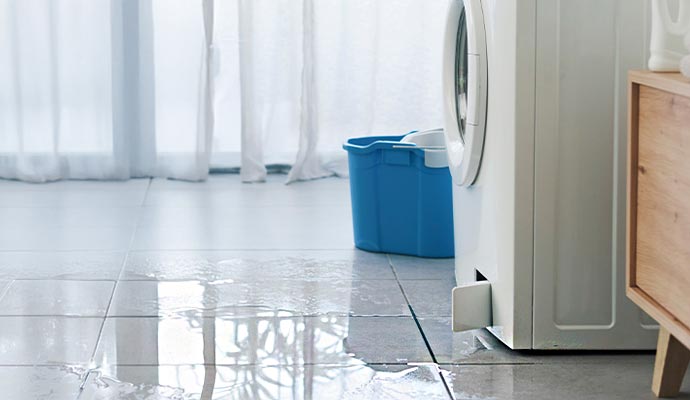 Water leaking from washing machine on the floor