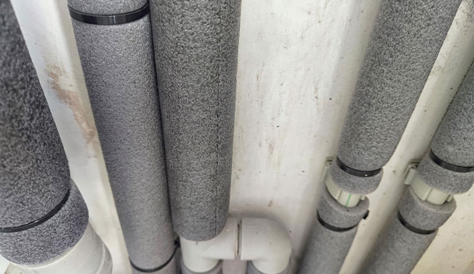 Water pipes installed with foam insulation